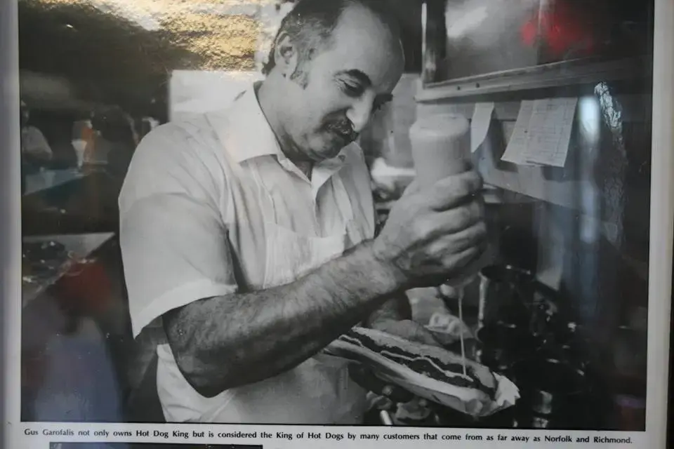 Gus making a famous all the way hot dog